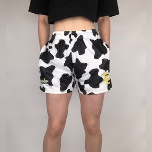 Inaka Power Black and White Cow Print Athletic Shorts with Yellow Logo